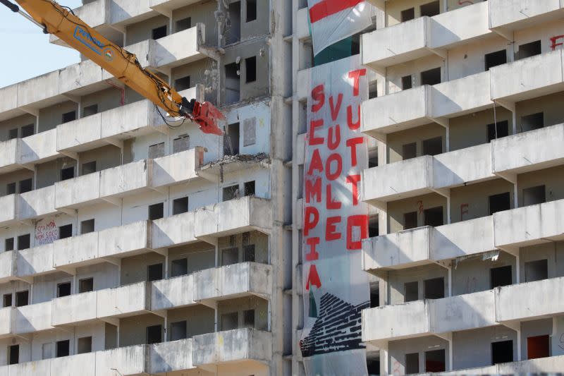 Banner reading ?Scampia wants all" are seen on the outside of the so-called "Sails of Scampia", a tower block known as a stronghold of Naples mafia