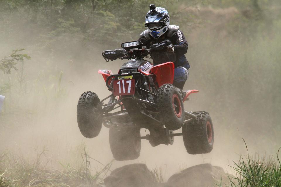 A racer clears a jump during the Heartland Challenge, a marathon 10-hour ATV race, held outside of Carlisle.