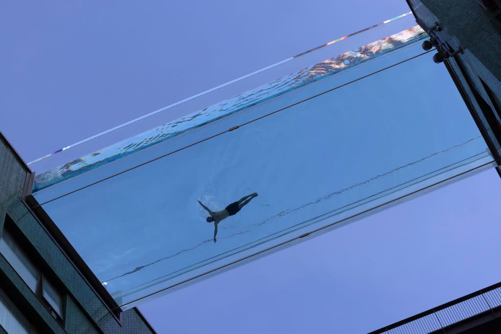 A swimmer takes part in a photoshoot to advertise the new 'sky pool' near Embassy Gardens in south-west London.