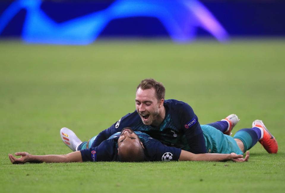 Tottenham's Christian Eriksen celebrates with teammate Lucas Moura, left, at the end of the Champions League semifinal second leg soccer match between Ajax and Tottenham Hotspur at the Johan Cruyff ArenA in Amsterdam, Netherlands, Wednesday, May 8, 2019. (AP Photo/Peter Dejong)