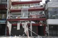 <p>A heavily damaged building stands after an earthquake in the Narvarte neighborhood of Mexico City, Tuesday, Sept. 19, 2017. A magnitude 7.1 earthquake has rocked central Mexico, killing at least 55 people as buildings collapsed in plumes of dust and thousands fled into the streets in panic. (AP Photo/Eduardo Verdugo) </p>