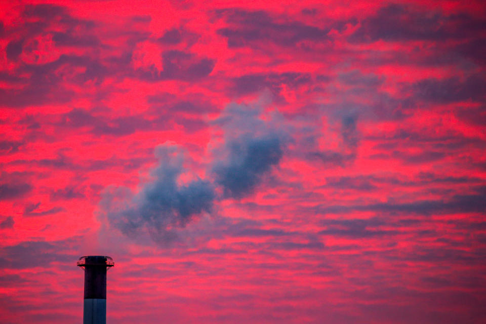 Steam rises from a smokestack at sunset in Lansing, Michigan. (Photo: Brendan McDermid / Reuters)