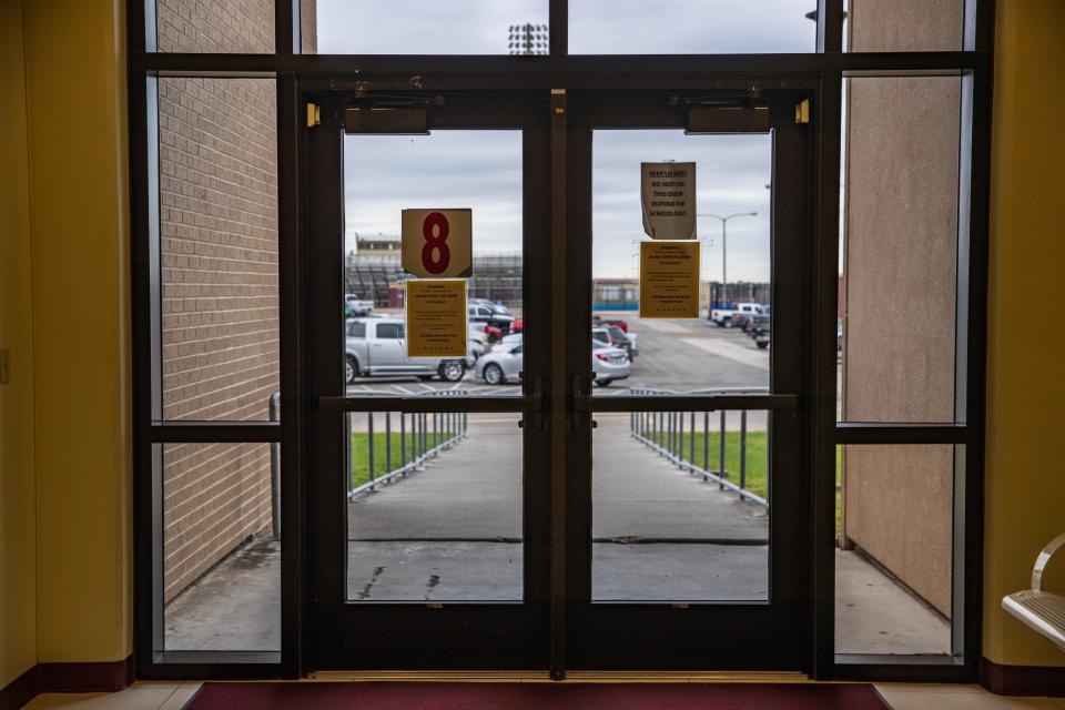Doors at Tuloso-Midway High School are part of a security concern, as seen on Thursday, Nov. 17, 2022, in Corpus Christi, Texas. After exiting the doors, which are the school's main access point to the athletic facilities, there is no fence separating the walk through the parking lot from public access. Voters rejected a proposed bond issue to pay for the project and more on the Nov. 8 ballot.