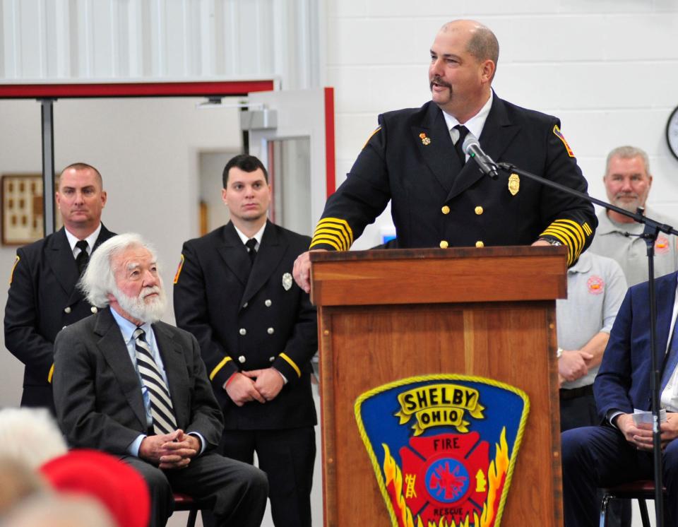 Shelby fire chief Michael Thompson speaks while local business owner Grant Milliron, seated at left, looks on during the opening of the new fire station in this News Journal file photo from November 2018.