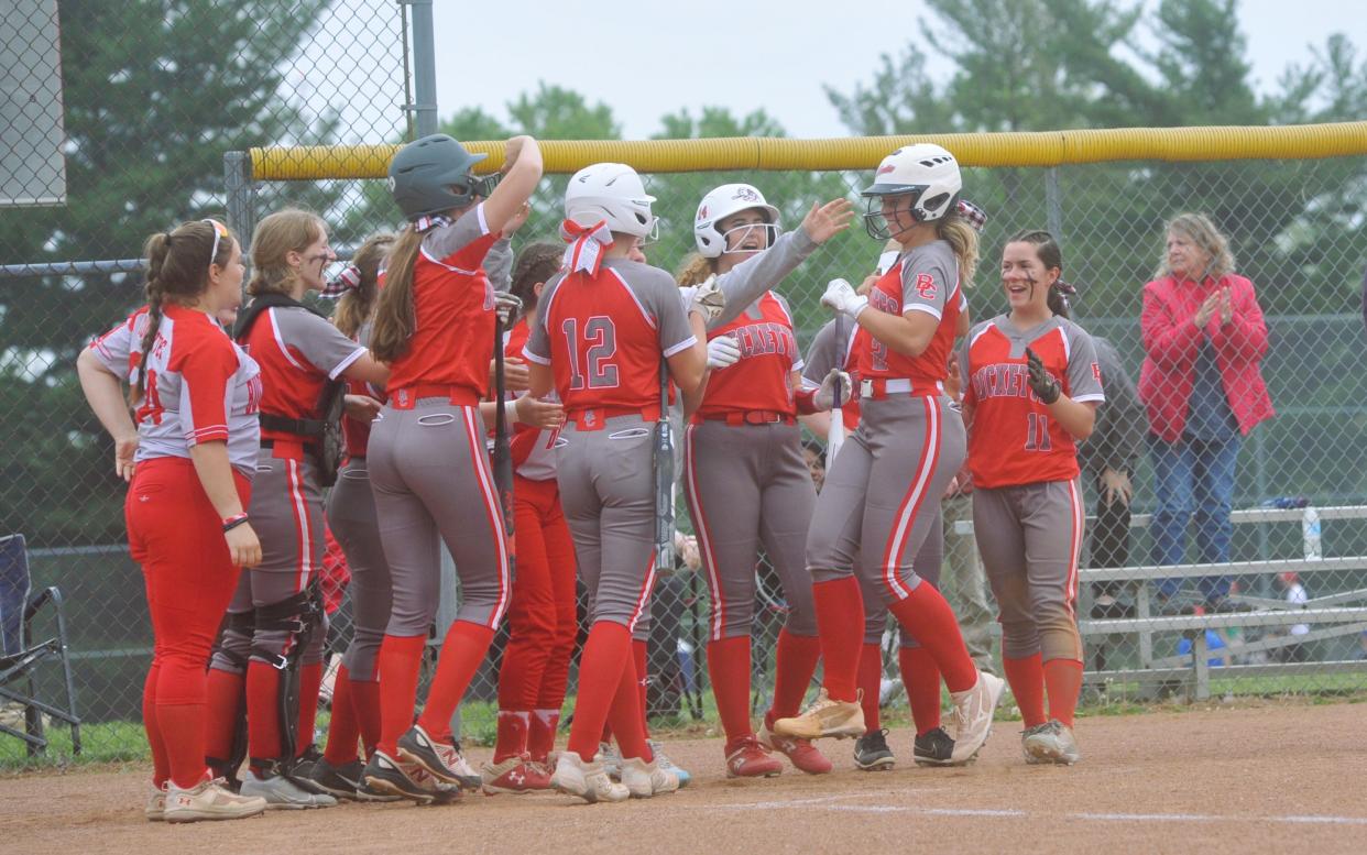 Buckeye Central's Grace Collene is greeted by her team at home plate after her momentum-shifting home run in the third inning.