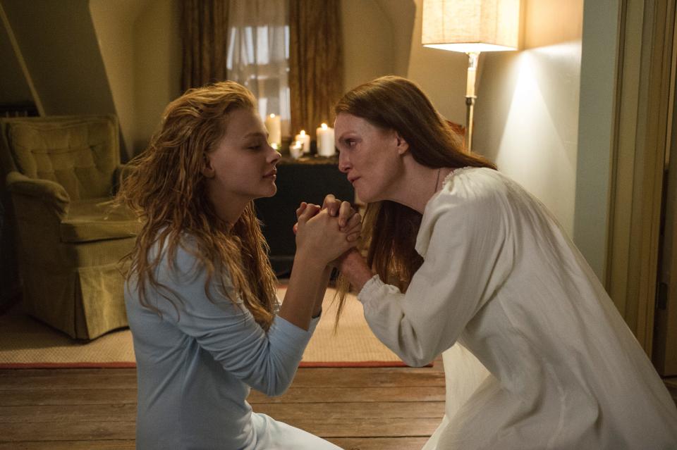 Chloe Grace Moretz, left, is a troubled telekinetic teen and Julianne Moore is her overly religious mom in "Carrie."