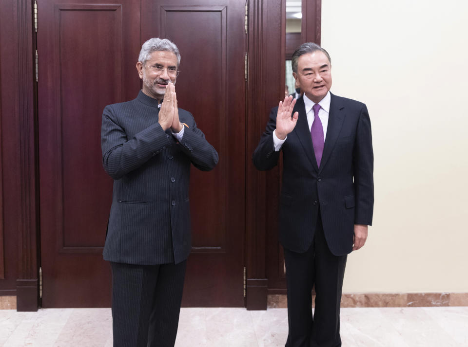 In this photo released by China's Xinhua News Agency, India's External Affairs Minister Subrahmanyam Jaishankar, left, and Chinese Foreign Minister Wang Yi pose for a photo as they meet on the sidelines of a meeting of the foreign ministers of the Shanghai Cooperation Organization (SCO) in Moscow, Russia on Sept. 10, 2020. The Indian and Chinese foreign ministers have agreed that their troops should disengage from a tense border standoff, maintain proper distance and ease tensions in the Ladakh region where the two sides in June had their deadliest clash in decades. (Bai Xueqi/Xinhua via AP)