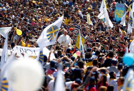 Pope Francis waves as he arrives to lead special audience for Catholic Action members in St. Peter's Square at the Vatican, April 30, 2017. REUTERS/Tony Gentile