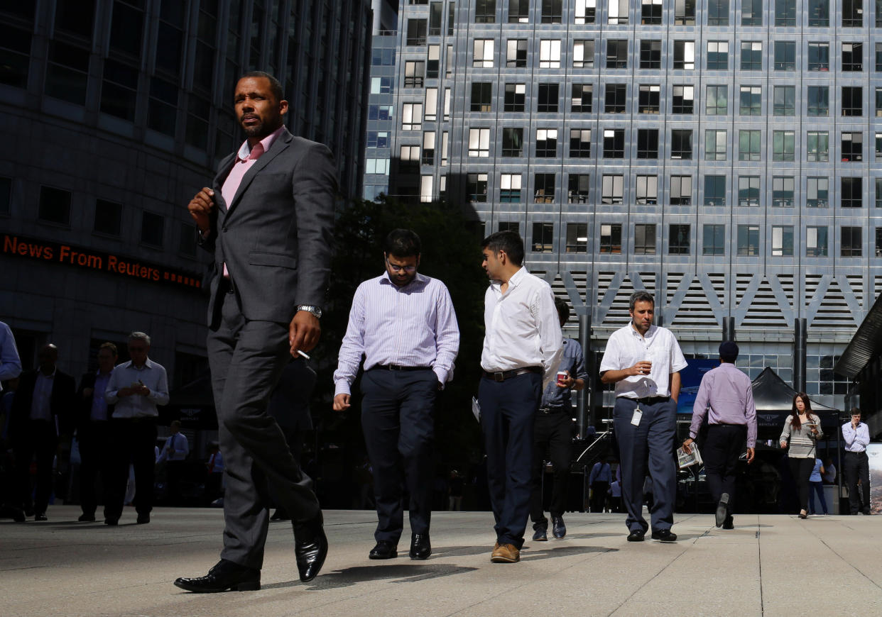 People walk through the Canary Wharf, the business and financial district in London, Britain, September 8, 2016. REUTERS/Kevin Coombs   