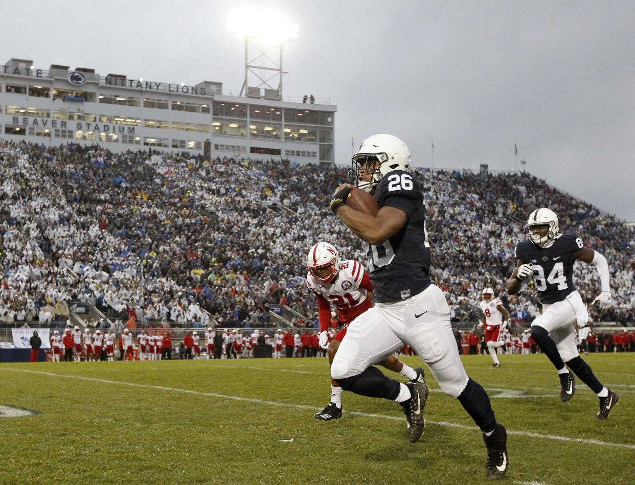 Penn State’s Saquon Barkley (26) takes the ball 65 yards for a touchdown against Nebraska during the first half of an NCAA college football game in State College, Pa., Saturday, Nov. 18, 2017. (AP Photo/Chris Knight)