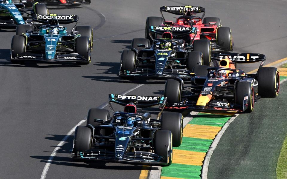 George Russell leads Red Bull Racing's Dutch driver Max Verstappen and Mercedes' British driver Lewis Hamilton at the start of the 2023 Formula One Australian Grand Prix at the Albert Park Circuit in Melbourne on April 2, 2023 - AFP via Getty Images