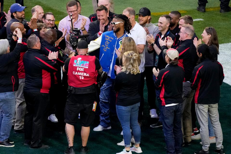 Buffalo Bills' Damar Hamlin, center, is surrounded on the field prior to the NFL Super Bowl 57 football game between the Kansas City Chiefs and the Philadelphia Eagles, Sunday, Feb. 12, 2023, in Glendale, Ariz.