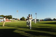 Steven Smith and Shaun Marsh of Australia leave the field at the end of play during day one of the First Test match between South Africa and Australia on February 12, 2014 in Centurion, South Africa. (Photo by Morne de Klerk/Getty Images)