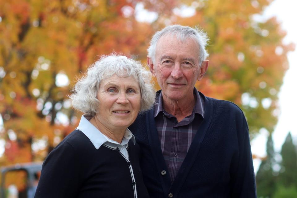 Christine and Jim Bonta, two long-time participants in the Stop the Spread COVID-19 study, pose for a photo outside their Ottawa home on Oct. 18, 2023.