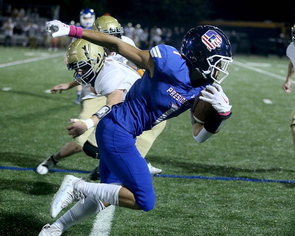 Quincy's Jacey Ham turns upfield after making the catch during first quarter action of their game against Hanover at Veterans Memorial Stadium in Quincy on Friday, Oct. 7, 2022.