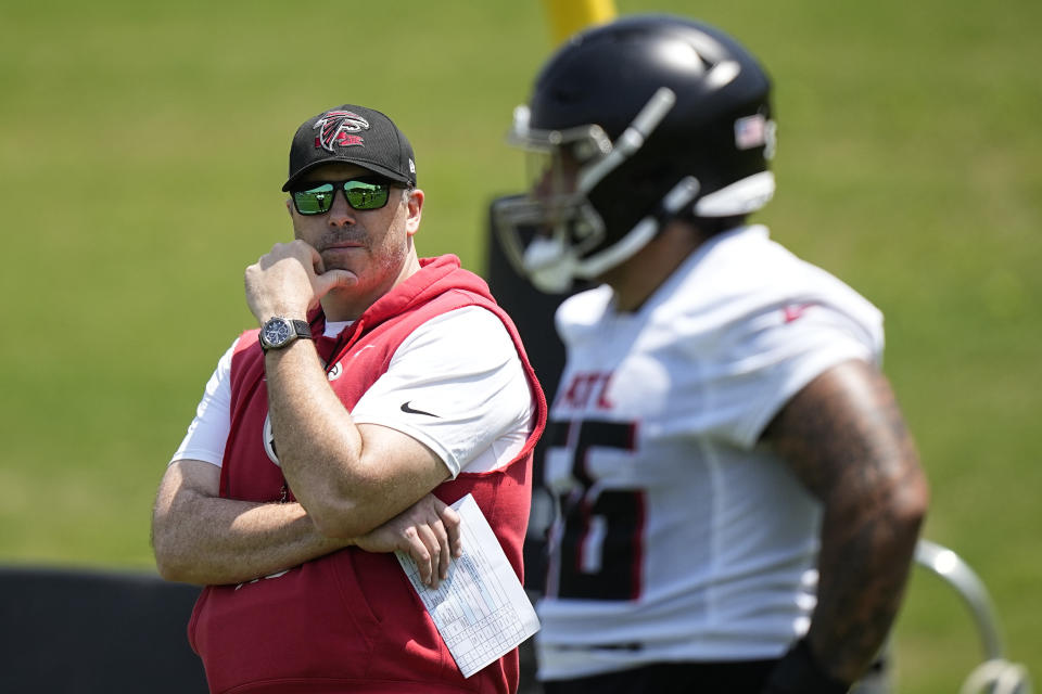 Atlanta Falcons head coach Arthur Smith watches offensive lineman Jovaughn Gwyn (56) during the NFL football team's rookie minicamp, Saturday, May 13, 2023, in Flowery Branch, Ga. (AP Photo/Brynn Anderson)