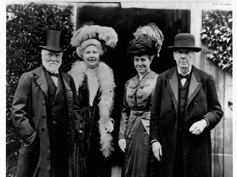 Andrew Carnegie stands next to his wife Louise and their guests for a photograph.