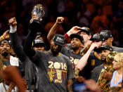 Jun 19, 2016; Oakland, CA, USA; Cleveland Cavaliers forward LeBron James (23) celebrates with the Bill Russell MVP Trophy after beating the Golden State Warriors in game seven of the NBA Finals at Oracle Arena. Mandatory Credit: Bob Donnan-USA TODAY Sports TPX IMAGES OF THE DAY