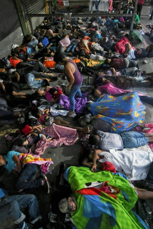 Honduran migrants sleep in the main square of Tecun Uman, Guatemala, on the border with Mexico