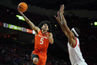 Illinois Fighting guard Andre Curbelo (5) goes up for a shot against Maryland guard Marcus Dockery during the first half of an NCAA college basketball game, Friday, Jan. 21, 2022, in College Park, Md. (AP Photo/Julio Cortez)