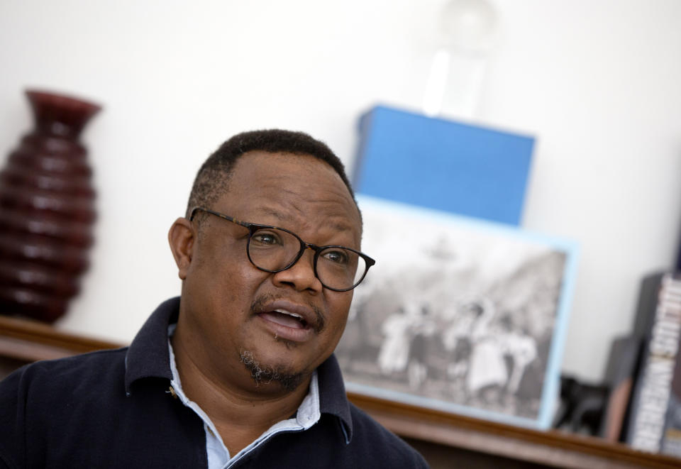 Exiled Tanzanian opposition leader Tundu Lissu gives an interview to The Associated Press in Tienen, Belgium on Friday, March 19, 2021. Speaking of Tanzania's new president Samia Suluhu Hassan, who was sworn-in on Friday, Lissu said "The immediate job, the immediate decision she has to make, and she doesn't have much time for it, is what is she going to do about COVID-19? President Magufuli defied the world, defied science, defied common sense in his approach to COVID-19 and it finally brought him down." (AP Photo/Virginia Mayo)