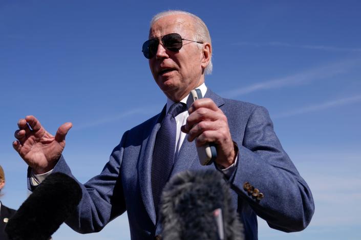 President Joe Biden talks with reporters before boarding Air Force One, Tuesday, April 11, 2023, at Andrews Air Force Base, Md. Biden is traveling the United Kingdom and Ireland in part to help celebrate the 25th anniversary of the Good Friday Agreement. (AP Photo/Patrick Semansky)