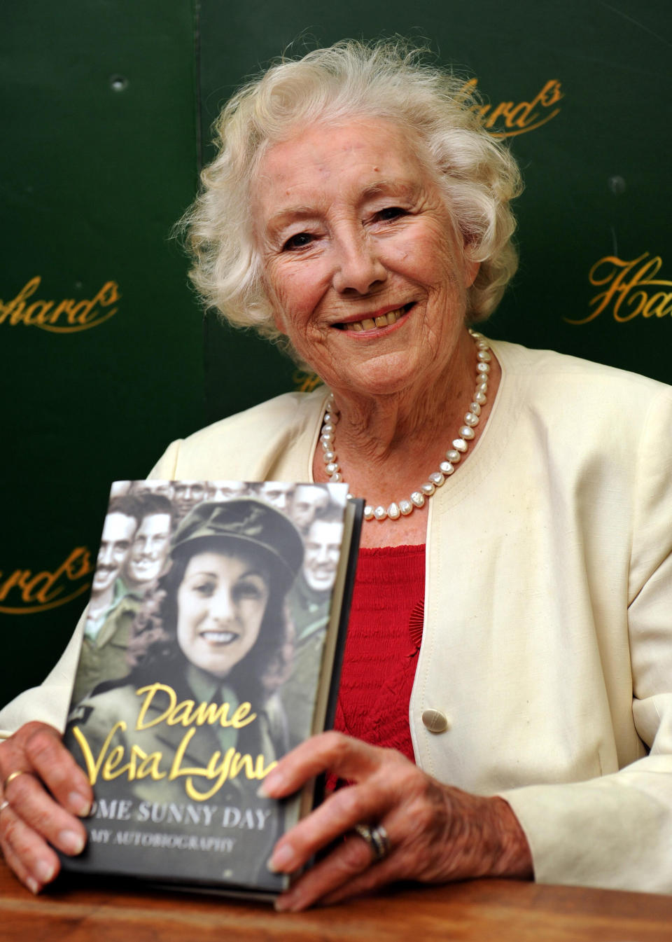 Dame Vera Lynn pictured with her autobiography 'Some Sunny Day'.