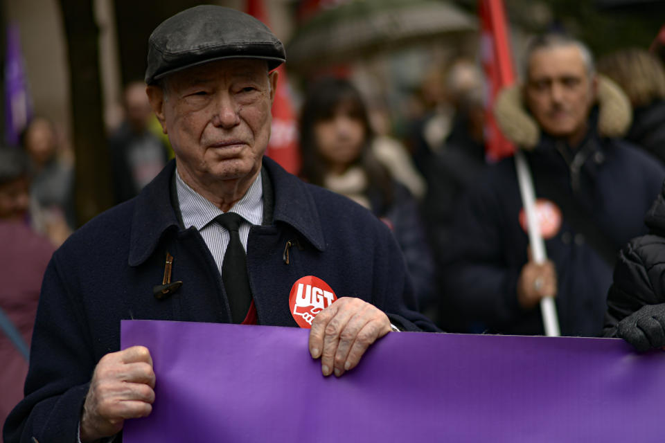 An elderly person takes part in a May Day rally in Pamplona, northern Spain, on Wednesday, May 1, 2024. (AP Photo/Alvaro Barrientos)