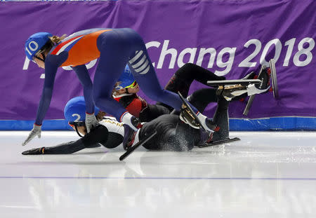 Speed Skating - Pyeongchang 2018 Winter Olympics - Women's Mass Start semifinal - Gangneung Oval - Gangneung, South Korea - February 24, 2018 - Annouk van der Weijden of the Netherlands, Ayano Sato of Japan and Ivanie Blondin of Canada fall. REUTERS/Phil Noble