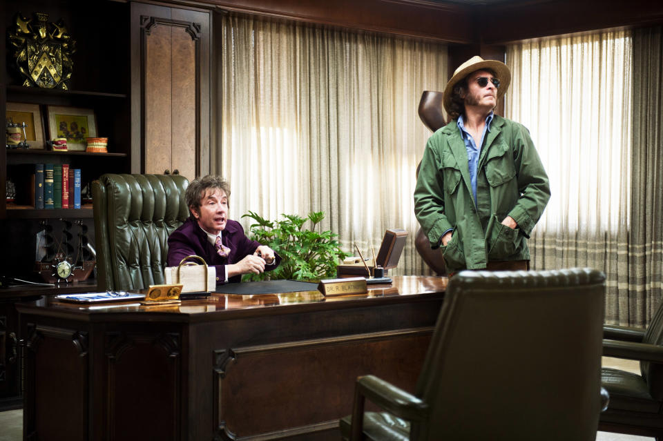 Short and Joaquin Phoenix in the Paul Thomas Anderson film <em>Inherent Vice</em>. (Photo: Wilson Webb/Warner Bros./Courtesy Everett Collection)