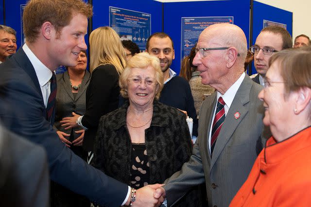 <p>Eddie Mulholland - WPA Pool/Getty</p> Sir Bobby Charlton and Prince Harry at the grand opening of the Royal British Legion Centre for Blast Injury Studies at Imperial College London