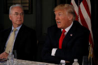 U.S. President Donald Trump (R), flanked by Secretary of Health and Human Services (HHS) Tom Price, delivers remarks on North Korea during an opioid-related briefing at Trump's golf estate in Bedminster, New Jersey, U.S., August 8, 2017. REUTERS/Jonathan Ernst