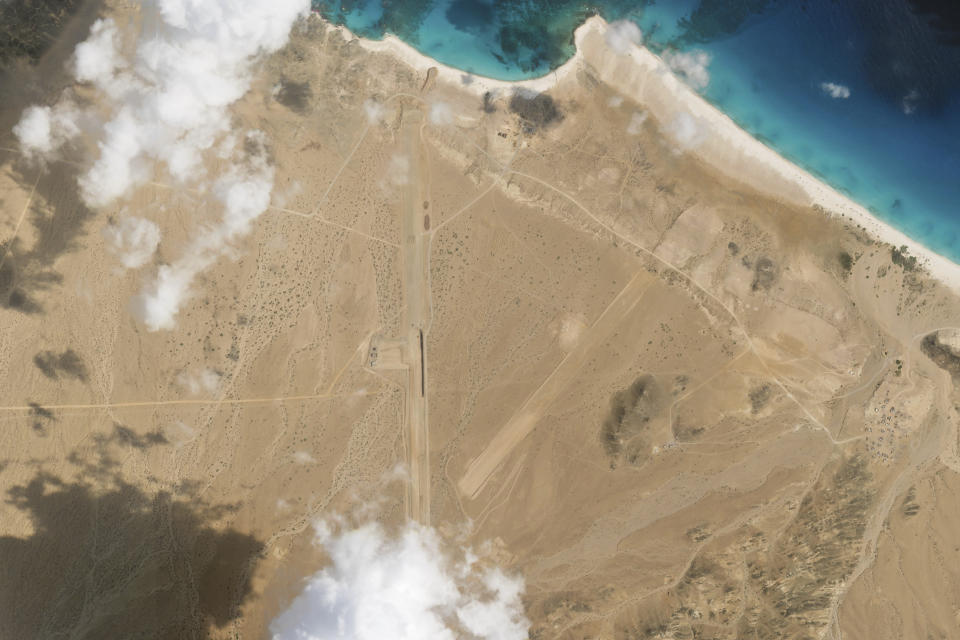 This satellite photo captured by Planet Labs PBC shows the construction of an airstrip on Abd al-Kuri Island, Yemen, Monday, March 25, 2024. As Yemen's Houthi rebels continue to target ships in a vital Mideast waterway, satellite pictures analyzed by The Associated Press show what appears to be a new airstrip being built at an entrance to that crucial maritime route. No country has claimed publicly the active construction taking place this month on Abd al-Kuri Island, a barren stretch of land rising out of the Indian Ocean near the mouth of the Gulf of Aden. However, satellite images shot for the AP appear to show workers have laid out "I LOVE UAE" next to the runway, an abbreviation for the United Arab Emirates. (Planet Labs PBC via AP)