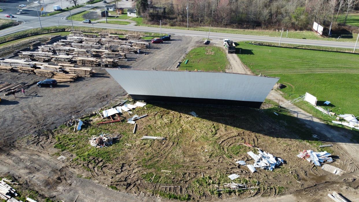 The Sunset Drive-In big screen was dropped Tuesday to make way for a new barn for Buckeye Barn Salvage at Ohio 309 and 314.