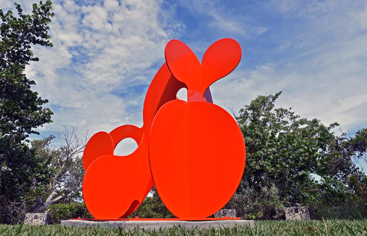 "Cheer" is a bright, orange abstract sculpture leaving the interpretation up to the eye of the beholder.