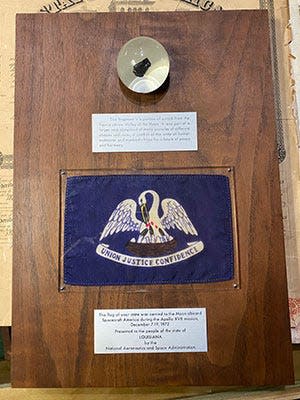 Louisiana's Apollo 17 goodwill moon rock display was returned to the state after being purchased by a gun collector at a Brevard County garage sale for its wooden plaque.