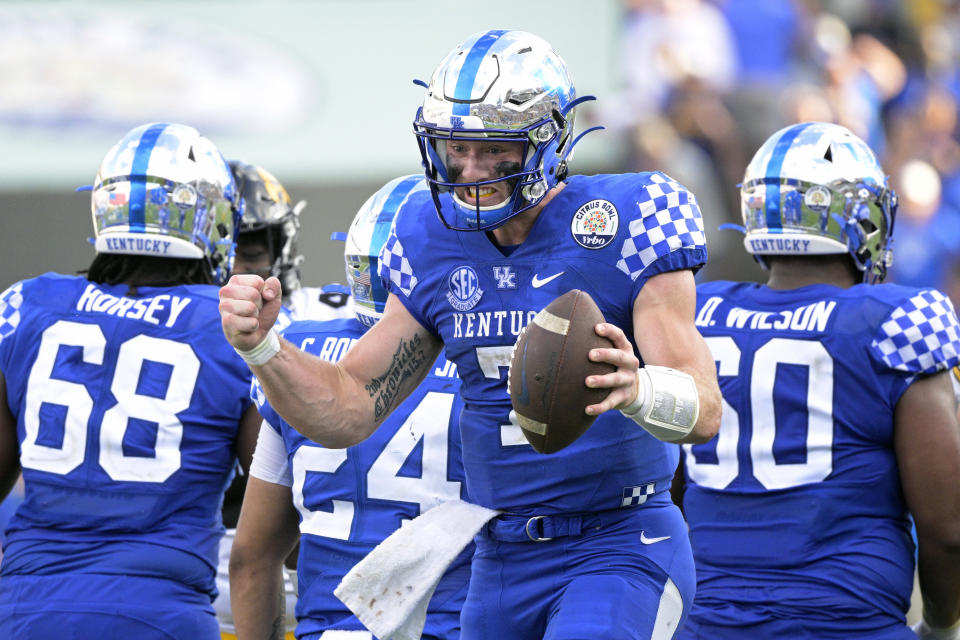 Kentucky quarterback Will Levis (7) celebrates after taking the final snap of the Citrus Bowl NCAA college football game win against Iowa, Saturday, Jan. 1, 2022, in Orlando, Fla. (AP Photo/Phelan M. Ebenhack)