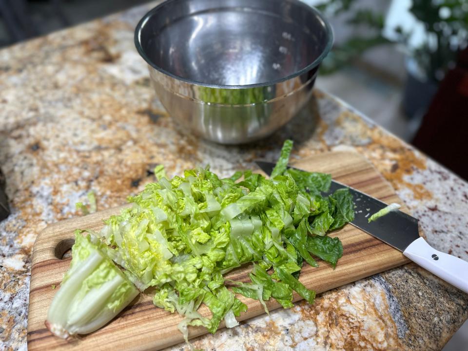 Chopped lettuce on cutting board 