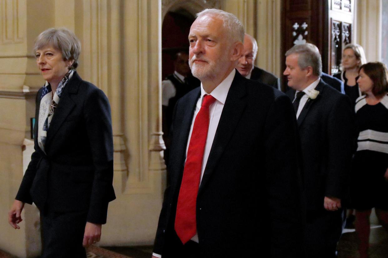 Theresa May and Jeremy Corbyn walk through the House of Lords during the State Opening of Parliament: Getty Images