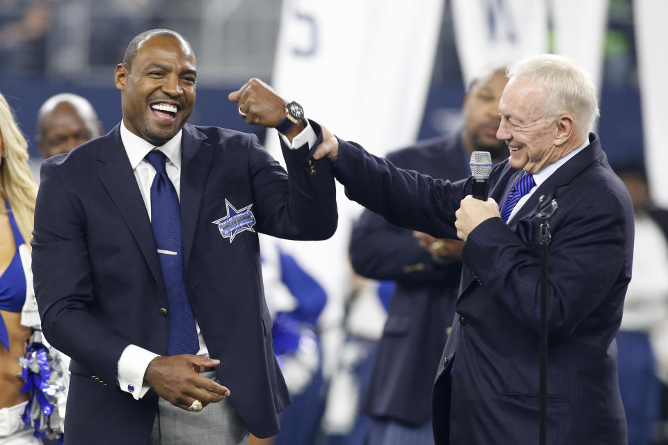 Nov 1, 2015; Arlington, TX, USA; Dallas Cowboys former player Darren Woodson (left) is congratulated by owner Jerry Jones during his induction into the ring of honor at halftime of the game against the Seattle Seahawks at AT&T Stadium. Seattle won 13-12. Mandatory Credit: Tim Heitman-USA TODAY Sports