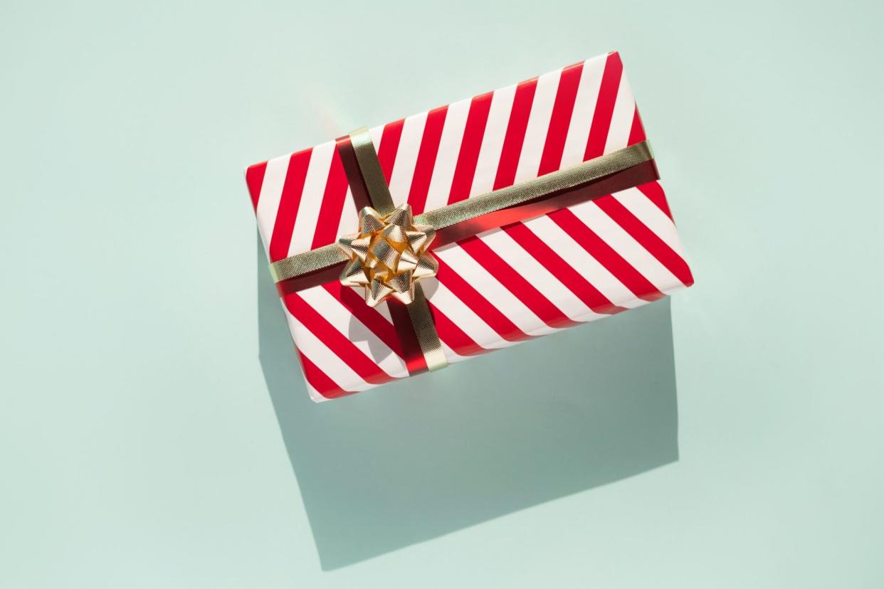 An image of a present on a colorful background.