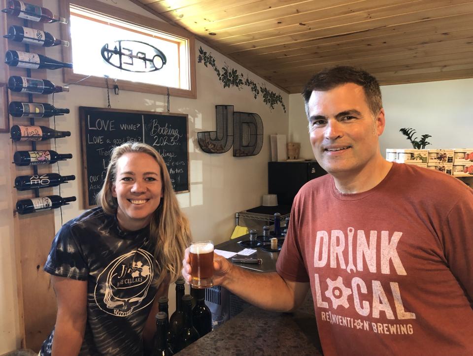 Audrey Allen, tasting room manager at JD Wine Cellars at Long Acre Farms in Macedon, and Reinvention Brewing Co. co-owner George Aldrich show off the 1823 Ale, which was brewed to commemmorate the bicentennial of Wayne County.