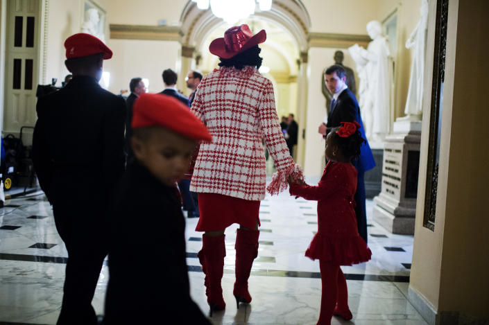 Rep. Frederica Wilson (D-Fla.) walks with her family through the Will Rogers Hallway after the swearing-in of the 114th Congress on the House floor on Jan. 6, 2015.