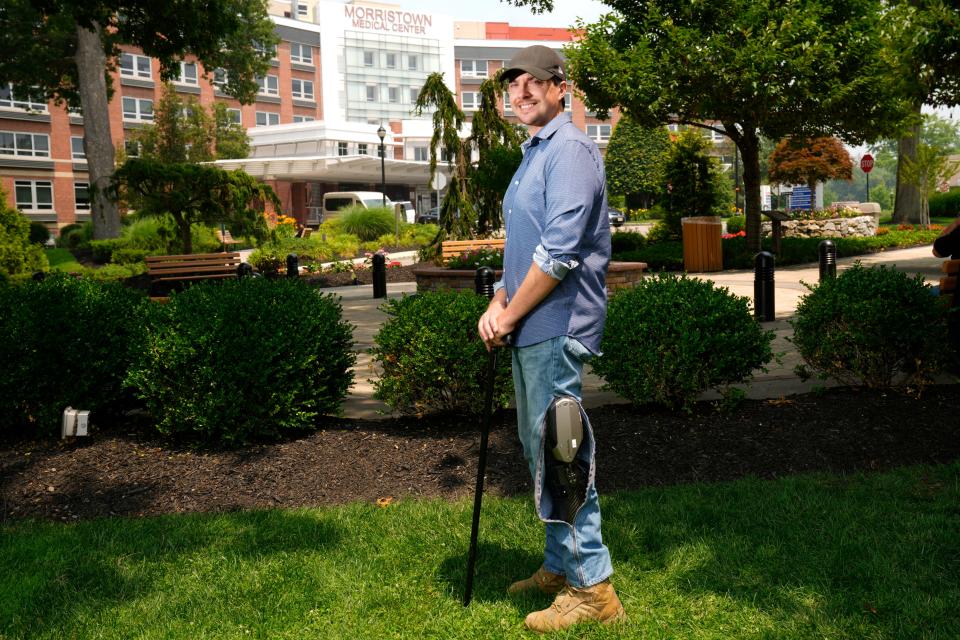 Ian Azeredo poses during a return to Morristown Medical Center, for a photography session and to reunite with those he calls miracle workers.  Azeredo was in the ICU for months after crashing to Earth at 70 miles per hour during a skydiving accident.  Thursday, June 29, 2023