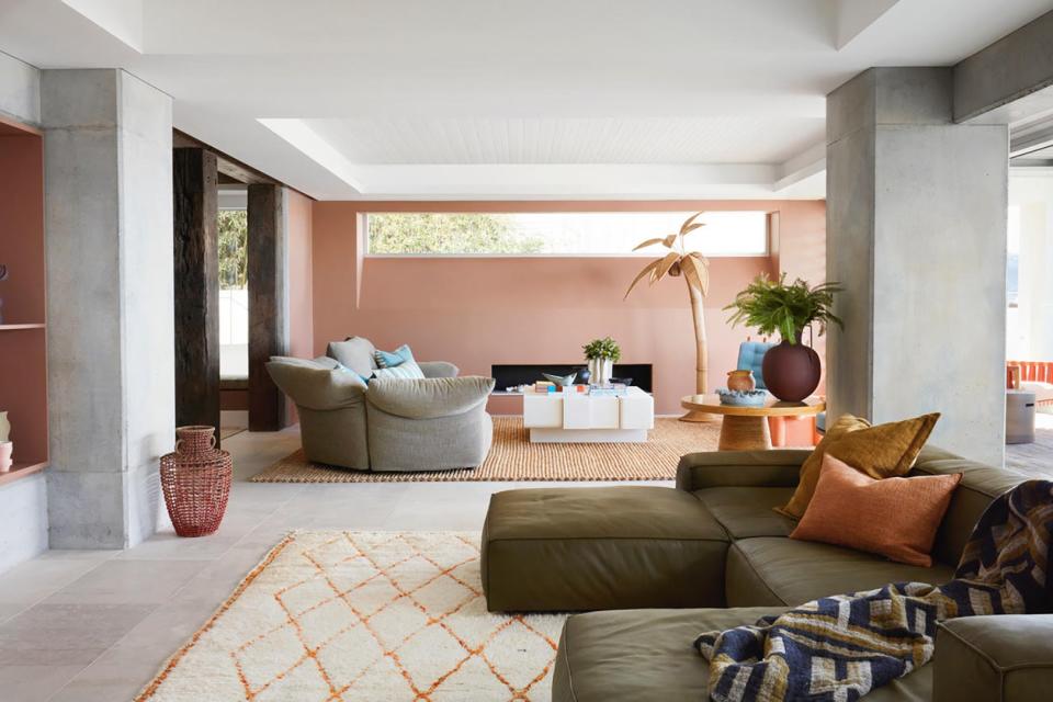 pink living room and green sofa