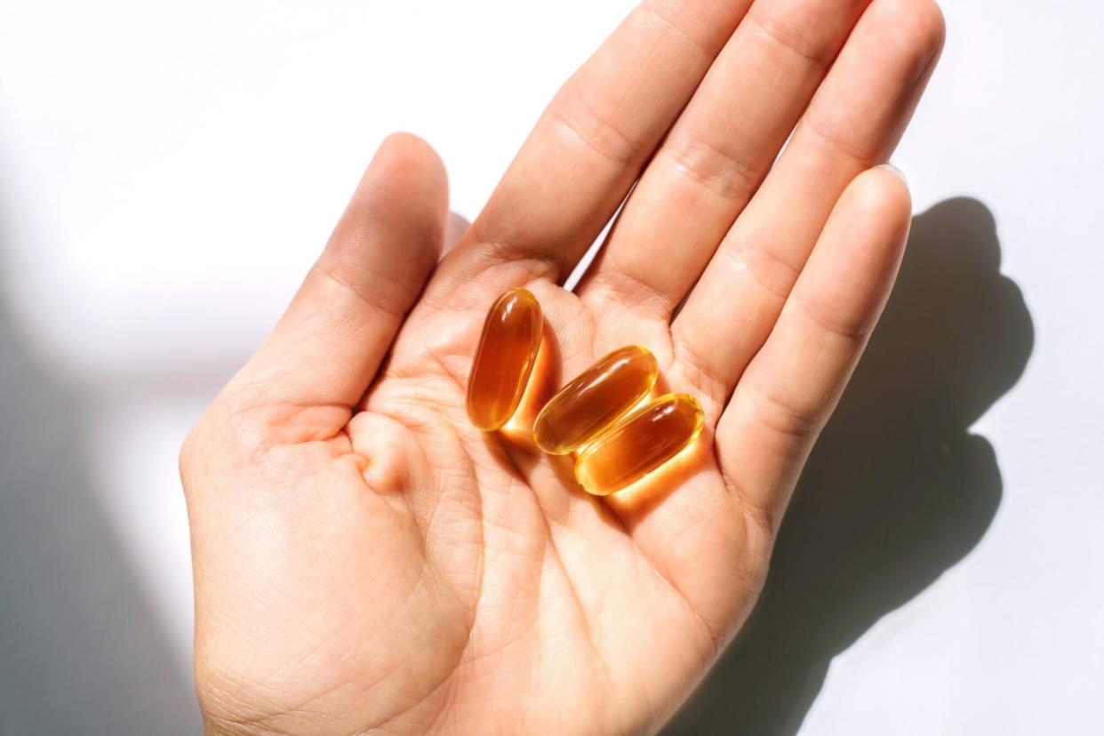 vitamin softgels in hand