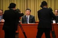 Chinese President Xi Jinping listens to a speech during an event to commemorate the 40th anniversary of the "Message to Compatriots in Taiwan" at the Great Hall of the People in Beijing, China January 2, 2019. REUTERS/Mark Schiefelbein/Pool