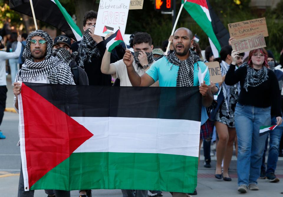 Protesters march on campus in response to the Palestine and Israel conflict, Thursday, Oct. 12, 2023, at Purdue University in West Lafayette, Ind.