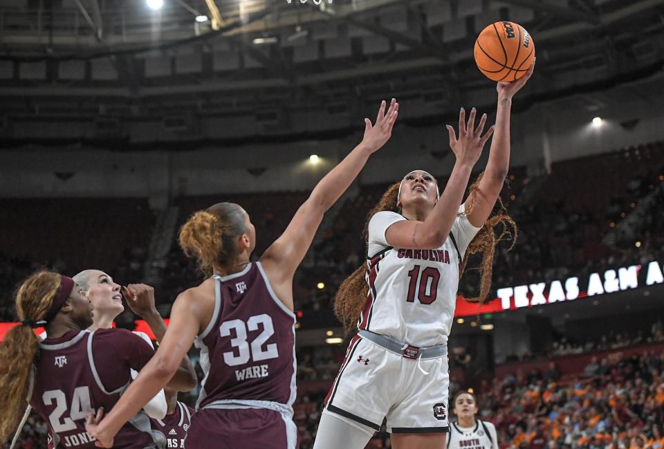 South Carolina center Kamilla Cardoso (10) makes a shot near Texas A & M forward Lauren Ware (32) during the third quarter of the SEC Women's Basketball Tournament game at the Bon Secours Wellness Arena in Greenville, S.C. Friday, March 8, 2024.