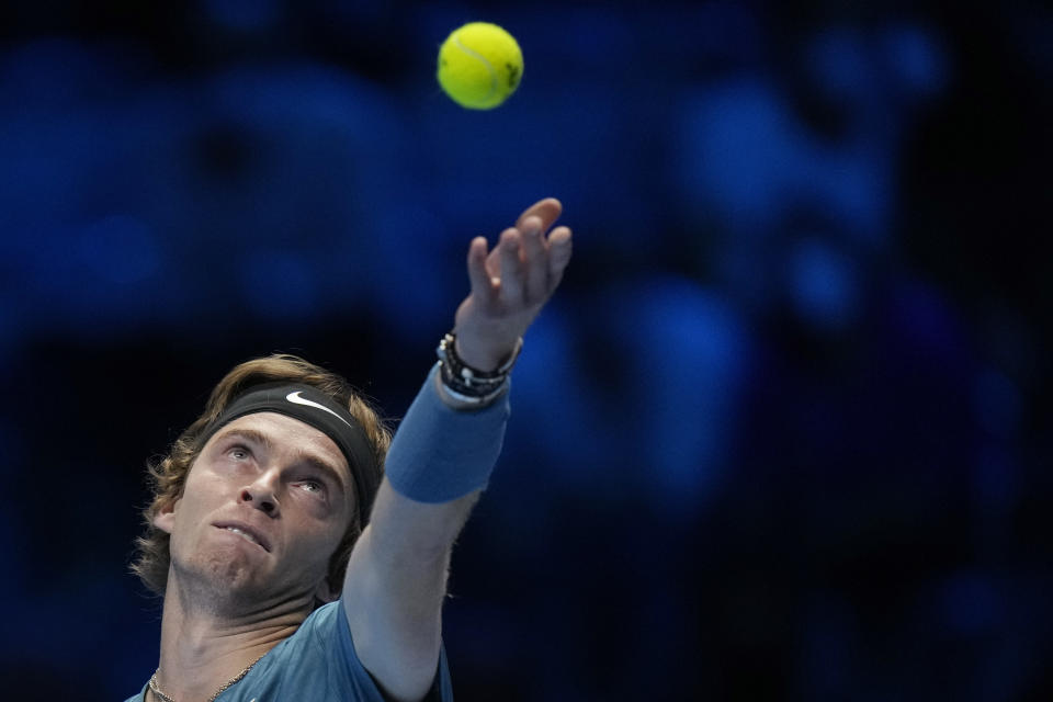 Russia's Andrey Rublev serves a ball to Serbia's Novak Djokovic during their ATP World Tour Finals singles tennis match, at the Pala Alpitour in Turin, Wednesday, Nov. 17, 2021. (AP Photo/Luca Bruno)